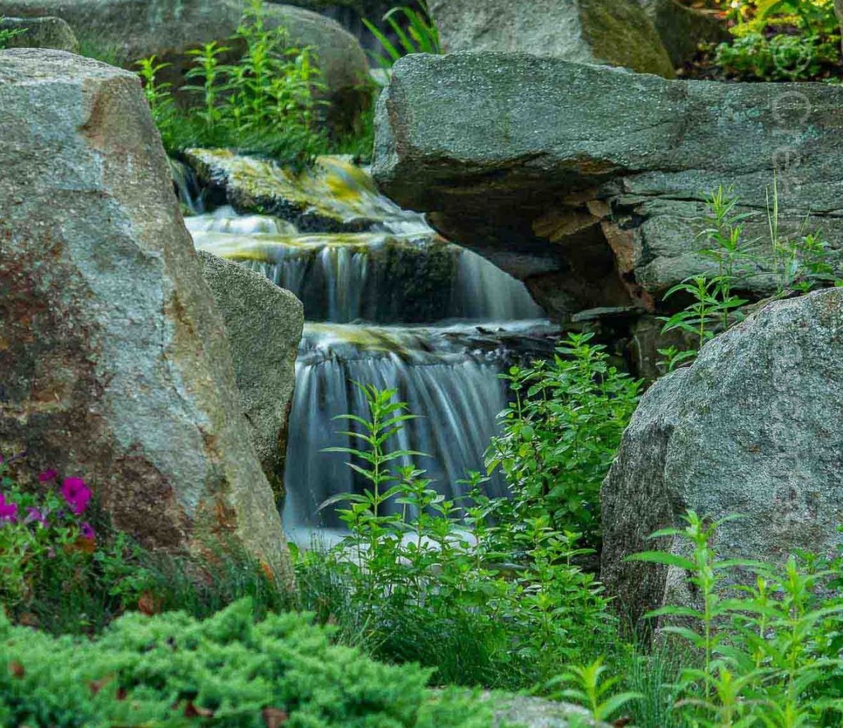 Very large green slate used in this pondless waterfall. Larger rocks look impressive but more expensive to transport & install.  - Landscaping and Water Features -  Creative Cascades