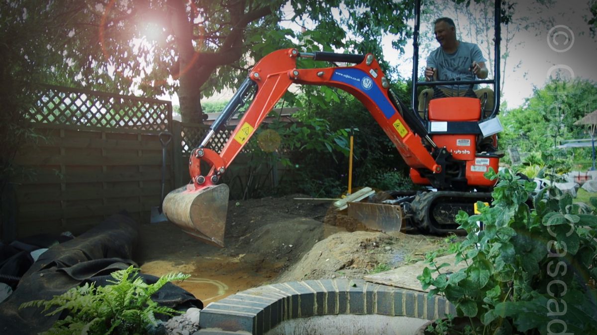 Larger jobs are quicker with a digger, Jim on duty here  - Landscaping and Water Features -  Creative Cascades