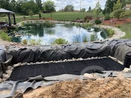 This is a wetland filter under construction, being added to a pond. Nothing comes close, this is the Rolls Royce of filters, based on natural principles.A wetland filter has far more filtering volume compared with anything factory made.  - Landscaping and Water Features -  Creative Cascades