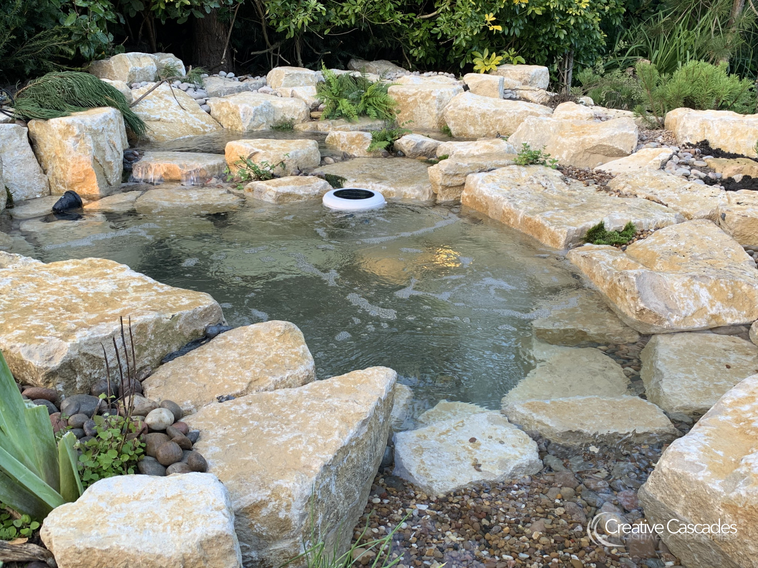 Putting finishing touches to this organic Jacuzzi which can be fitted with a water heater or left as is for bracing dips  - Landscaping and Water Features -  Creative Cascades