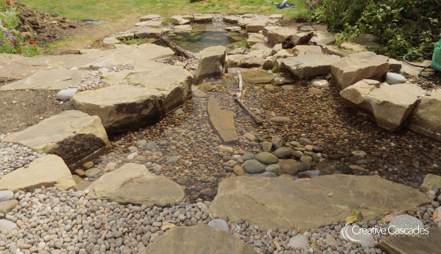 the same pond as in the previous photo, up and running.  - Landscaping and Water Features -  Creative Cascades